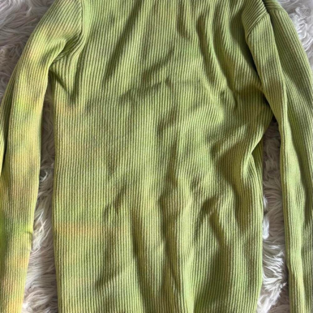 Green ribbed knit turtleneck sweater